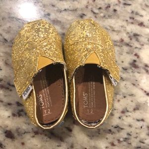 Gold glitter tiny Toms size 2